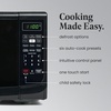 image:imageFarberware 07 Cu Ft Countertop Microwave Oven  700 Watts Power Auto Cook Settings Defrost Easy Clean and Child Safety Lock  WhiteBlack