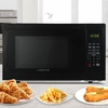 image:imageFarberware 07 Cu Ft Countertop Microwave Oven  700 Watts Power Auto Cook Settings Defrost Easy Clean and Child Safety Lock  WhiteBlack