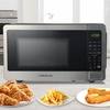 image:imageFarberware 07 Cu Ft Countertop Microwave Oven  700 Watts Power Auto Cook Settings Defrost Easy Clean and Child Safety Lock  WhiteStainless Steel