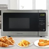 image:imageFarberware 07 Cu Ft Countertop Microwave Oven  700 Watts Power Auto Cook Settings Defrost Easy Clean and Child Safety Lock  WhiteStainless Steel