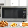 image:imageFarberware 07 Cu Ft Countertop Microwave Oven  700 Watts Power Auto Cook Settings Defrost Easy Clean and Child Safety Lock  WhiteStainless Steel