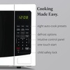 image:imageFarberware 07 Cu Ft Countertop Microwave Oven  700 Watts Power Auto Cook Settings Defrost Easy Clean and Child Safety Lock  WhiteWhite