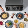 image:imageFarberware 11 Cu Ft Countertop Microwave Oven  1000 Watts Power Auto Cook Settings Defrost Easy Clean and Child Safety Lock  Stainless and BlackStainless Steel