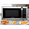 image:imageFarberware 13 Cu Ft Countertop Microwave Oven  1100 Watts Power Auto Cook Settings Defrost Easy Clean and Child Safety Lock  StainlessStainless Steel