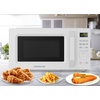 image:imageFarberware 13 Cu Ft Countertop Microwave Oven  1100 Watts Power Auto Cook Settings Defrost Easy Clean and Child Safety Lock  StainlessWhite