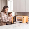 image:imageNostalgia Modern Retro Compact Countertop Microwave Oven  07 Cu Ft  700Watts with LED Digital Display  Child Lock  Easy Clean Interior  LavenderOrange