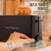 image:imageNostalgia Slim 2Slice Toaster  Wide Slot  SpaceSaving Design  Adjustable Browning Dial  10inch Long Slot Fits 2 Slices of Bread or Bagel Halves  Dropdown Crumb Tray  BlackberryBlack