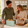 image:imageNostalgia Slim 2Slice Toaster  Wide Slot  SpaceSaving Design  Adjustable Browning Dial  10inch Long Slot Fits 2 Slices of Bread or Bagel Halves  Dropdown Crumb Tray  BlackberrySage