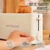 image:imageNostalgia Slim 2Slice Toaster  Wide Slot  SpaceSaving Design  Adjustable Browning Dial  10inch Long Slot Fits 2 Slices of Bread or Bagel Halves  Dropdown Crumb Tray  BlackberryOatmeal