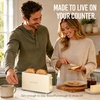 image:imageNostalgia Slim 2Slice Toaster  Wide Slot  SpaceSaving Design  Adjustable Browning Dial  10inch Long Slot Fits 2 Slices of Bread or Bagel Halves  Dropdown Crumb Tray  BlackberryOatmeal